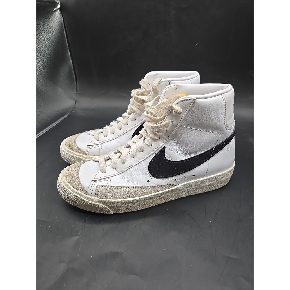 Nike White High-Top Sneakers with Black Swoosh